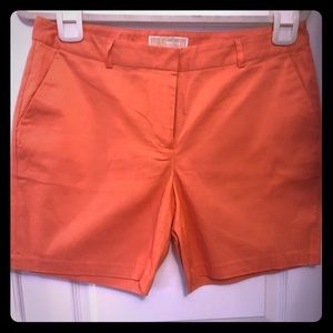 Michael Kors Orange shorts.